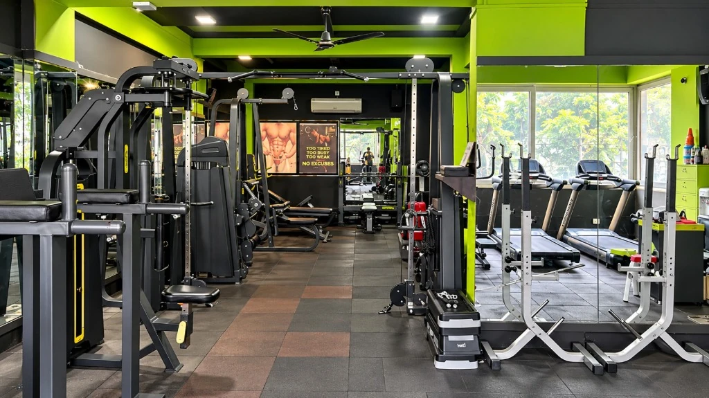 Power House Gym main training floor with cable crossover and Olympic weightlifting in Shahupuri Kolhapur